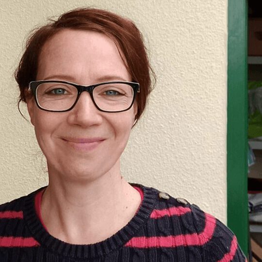 portrait photograph of Sophie smiling looking at the camera